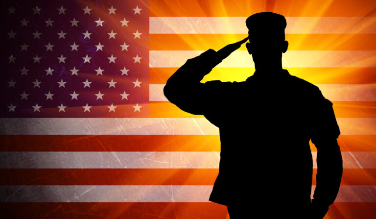 It services for defense contractors personified: a dedicated defense contractor saluting with pride against the backdrop of the american flag, embodying unwavering commitment and service.