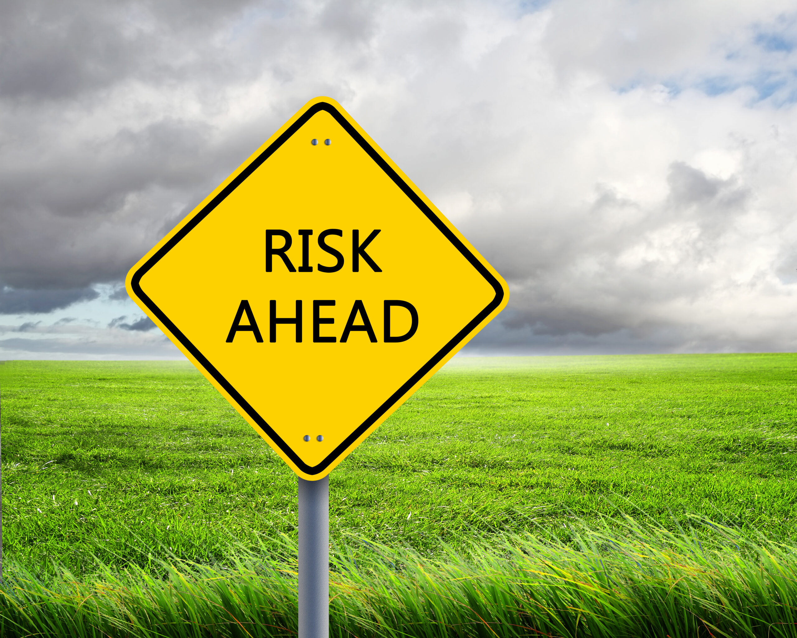 Road sign of risk ahead. Are you preventing insider threats from happening at your business?