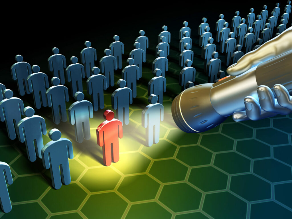 A robot is illuminating a group of people to mitigate insider threats.