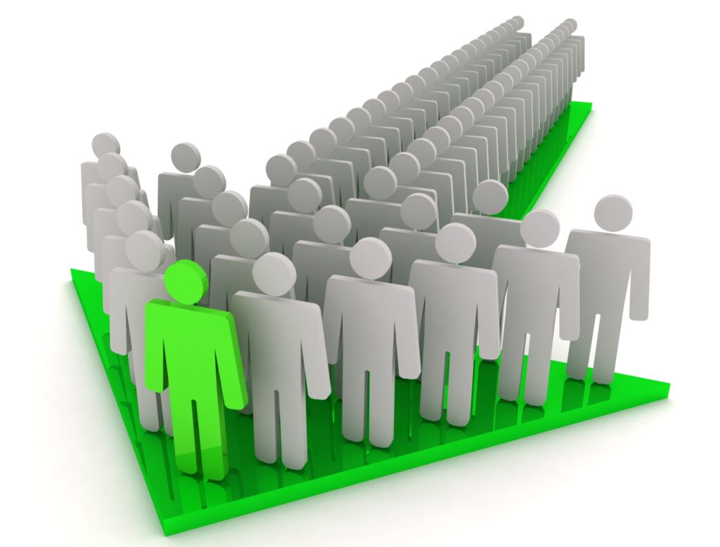 An image showcasing a crowd of people with a prominent leader on an arrow, metaphorically illustrating the concept of human error in cybersecurity. The leader represents the vulnerability of a single human mistake leading the masses, emphasizing the need for vigilance and education in cybersecurity practices.