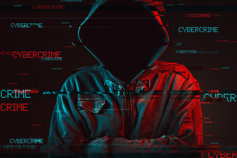 A digital composite image of a faceless person in a hoodie with the word "cyber security" repeatedly overlaid in red and blue glitch effect.